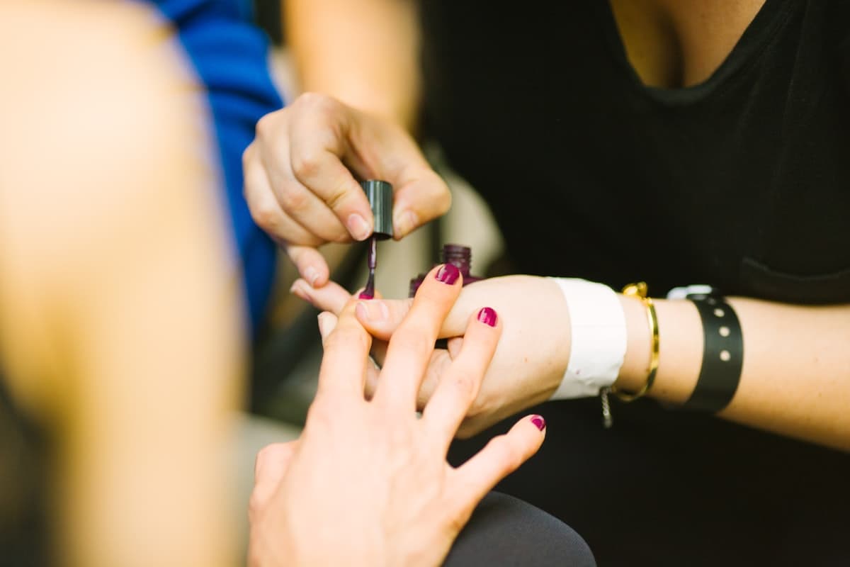 A bracelet being tied on for the mehndi afternoon